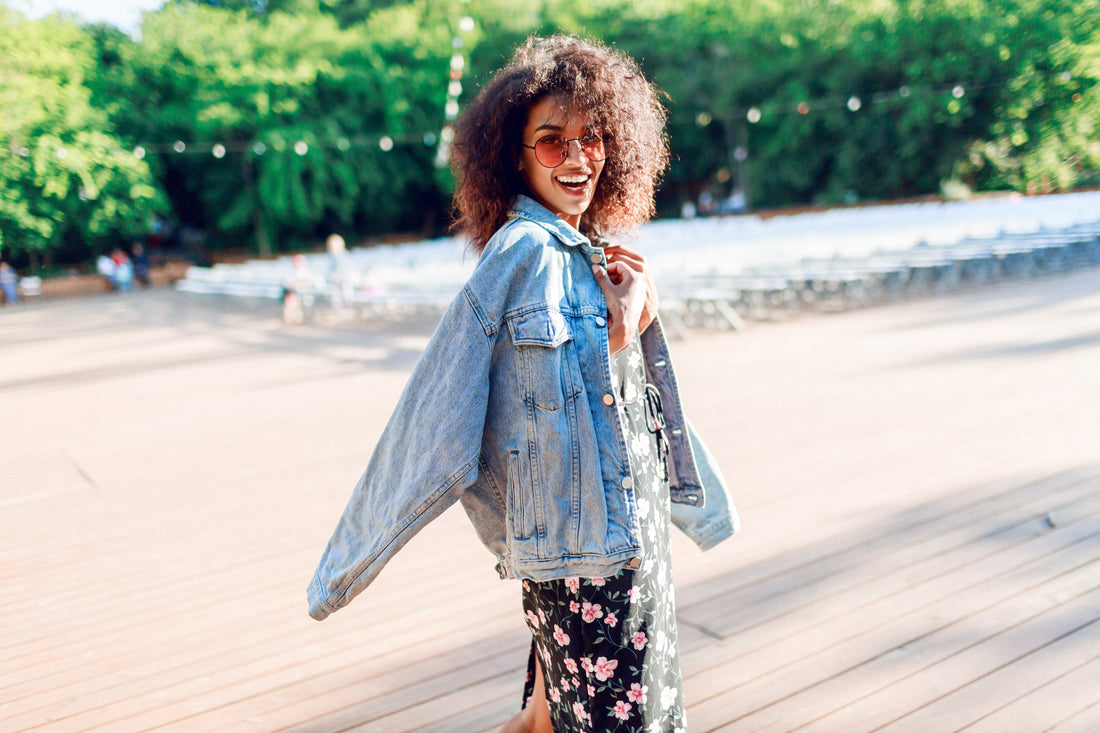 woman in sunnies and denim jacket